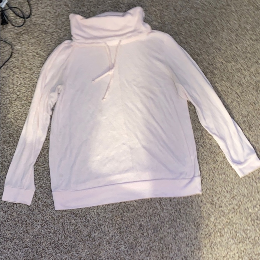 Light pink women’s sweater or a jacket. Size L